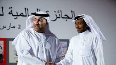 Abdo Khal, a Saudi novelist, is congratulated by Abdul Rahman Al Owais, Minister of Culture, Youth and Development. Khal won the 2010 International Prize for Arabic Fiction, which was awarded in March.