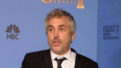 Alfonso Cuaron celebrates winning Best Director - Motion Picture for Gravity. AFP