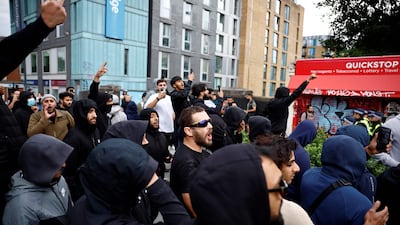 A group of Muslim residents rally outside the Waltham Forest Immigration Bureau offices in Walthamstow. AFP