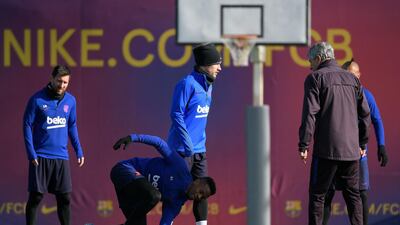 Barcelona manager Quique Setien with Lionel Messi Antoine Griezmann, and Samuel Umtiti during a training session at the Joan Gamper Sports City. AFP