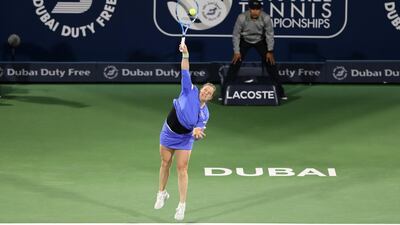 Kim Clijsters returns to Garbine Muguruza during the Dubai Duty Free Tennis Championships. Chris Whiteoak / The National