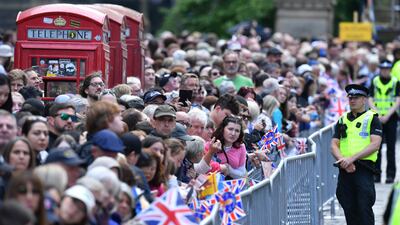 Members of the public gather. Getty