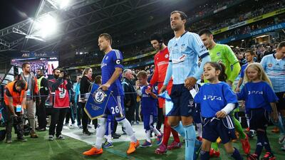 Chelsea captain John Terry and Sydney FC captain Alex Brosque lead their teams onto the pitch during the international friendly match between Sydney FC and Chelsea FC at ANZ Stadium on June 2, 2015 in Sydney, Australia. (Photo by Matt King/Getty Images)