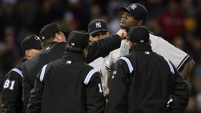 New York Yankees starting pitcher Michael Pineda, second from the right, is inspected by home plate umpire Gerry Davis, second from left, during the second inning against the Boston Red Sox at Fenway Park in Boston, Massachusetts, on April 23, 2014. Pineda was ejected from the game for pine tar. CJ Gunther / EPA