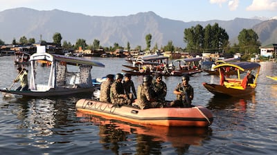 Indian paramilitary soldiers patrol Dal Lake in Srinagar. EPA