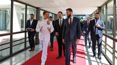 Admiral Brad Cooper with Ahmad Al Shara in Damascus on Friday. Photo: Sana / X