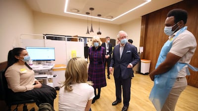 Prince Charles and Camilla, Duchess of Cornwall speak to staff at the Queen Elizabeth Hospital. AFP