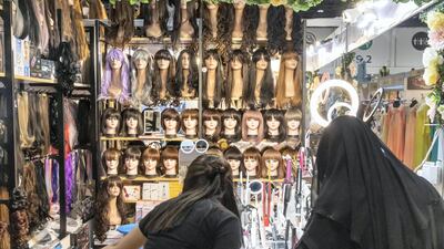 A quirky part of the Ramadan and Eid Festival is the amount of wigs on sale. Antonie Robertson / The National