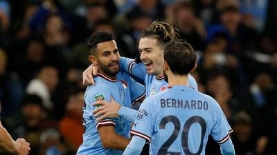 City's Riyad Mahrez celebrates scoring with Jack Grealish and Bernardo Silva. Reuters