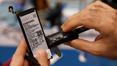 A Samsung Note 7 battery is measured for its physical dimensions at the laboratory in Singapore. Edgar Su / Reuters