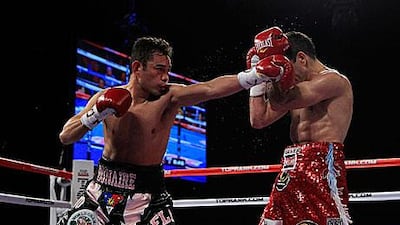 Omar Narvaez, right, kept his defences up against the champion Nonito Donaire, who was 'bored' with his challengers defensive tactics.