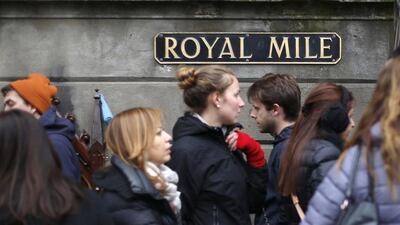 Pedestrians walk along the Royal Mile, a busy street which runs from Edinburgh Castle to Holyrood Palace, in Edinburgh. Suzanne Plunkett / Reuters