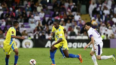 Makhete Diop, centre, of Al Dhafra spoiled Al Ain’s party at Hazza Bin Zayed Stadium with a late equaliser in the teams’ 1-1 draw on Friday. Pawan Singh / The National