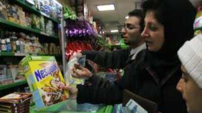 Customers buying Nestlé products in a shop in Tehran.