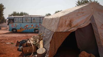 A bus converted into a classroom arrives to a camp in the village of Hazano.