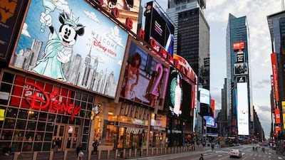 A police officer walks across an empty Seventh Avenue in a sparsely populated Times Square due to COVID-19 concerns in New York. AP