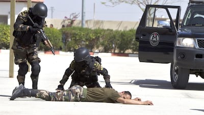 As a female officer, traditional roles would have been in administration, but new recruitment drives appeal to women who want adventure. . Ahmad Gharabli / AFP