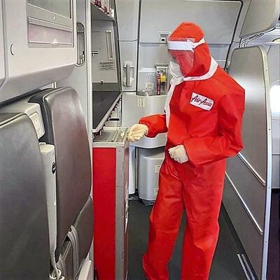 The designer PPE suits have a hood, mask and visor and were introduced on a repatriation flight from Bangkok to Manila. Courtesy Air Asia
