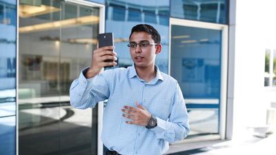 Sheikh Rehmatullah demonstrates how to use the Periscope app in Media City in Dubai. Sarah Dea / The National