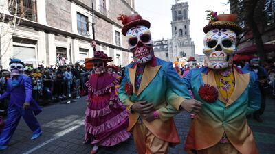 People participate in the main avenues in a parade to commemorate the Day of the Dead in Mexico City. EPA