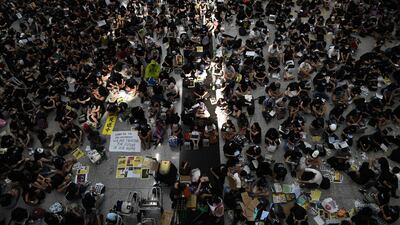About a thousand protesters, mostly young and wearing black T-shirts, held a sit-in and distributed flyers headlined "Dear travellers". AFP