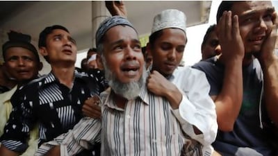 Thousands of Muslims attended the funerals at Yaeway cemetery in Yangon for the 13 boys killed in a mosque fire.