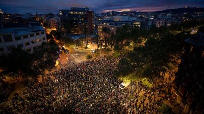 Pro-independence demonstrators gather next to the department of Interior in Catalonia, during a demonstration in Barcelona, Spain. AP Photo