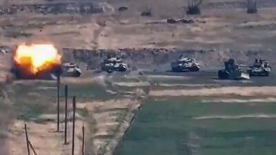 A still photo taken from a video provided by the Armenian Ministry of Defence shows the defeat of Azerbaijani armoured vehicles at Nagorno-Karabakh, on a border of Armenia and Azerbaijan, on September 27, 2020. EPA