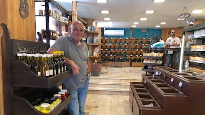 Sami Matouk (L), founder of a family spice business, at his shop in Amman. Khaled Yacoub Oweis / The National