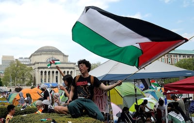 Protestors wave Palestinian flags on the West Lawn of Columbia University in April 2024. AFP