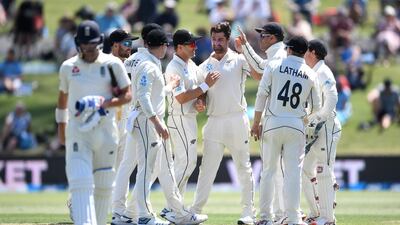 Colin de Grandhomme of New Zealand celebrates with teammates after dismissing England's Rory Burns. Getty