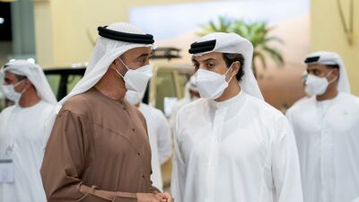 Sheikh Mohamed bin Zayed, Crown Prince of Abu Dhabi and Deputy Supreme Commander of the UAE Armed Forces, left, speaks with Sheikh Mansour bin Zayed, UAE Deputy Prime Minister and Minister of Presidential Affairs.