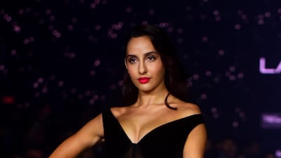 Nora Fatehi showcases a creation by designer Gauri and Nainika during Lakme Fashion Week in Mumbai. AFP