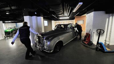 A Rolls-Royce Silver Cloud ll — Cub 1 used in the film A View To A Kill is loaded in to the London Film Museum.