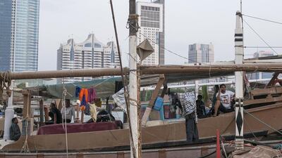 Fishermen around the Mina Fish Market in Abu Dhabi. A small but vibrant community has developed around the market and old port area. Mona Al Marzooqi / The National