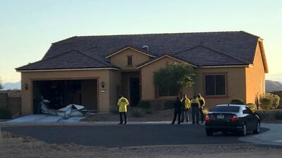 Police personnel stand outside the home of Stephen Paddock on Monday, October 2, 2017, in Mesquite. Police identified Paddock as the gunman at a music festival on Sunday evening. Mesquite Police via AP