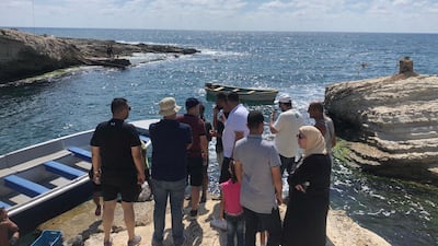 Tourists wait to board a boat. Jamie Prentis / The National