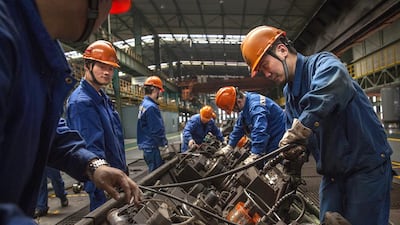 Workers maintain the production line at the Zhong Tian (Zenith) Steel Group Corporation. China's manufacturing profits have soared. Kevin Frayer/Getty