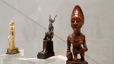 Maternity through the ages (left to right): a medieval French statue of the Virgin Mary and infant Jesus, the ancient Egyptian goddess Isis nursing Horus, and a 19th century figure from Congo's Yombe culture. The National