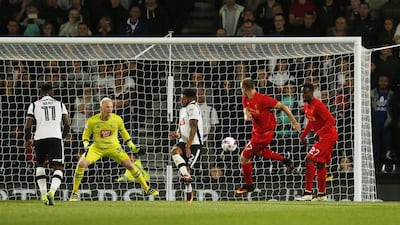 Liverpool’s Ragnar Klavan scores their first goal. Andrew Boyers / Action Images / Reuters
