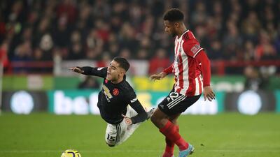 Manchester United's Andreas Pereira is challenged by Lys Mousset of Sheffield United. Reuters