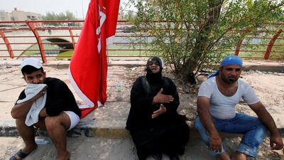 Mourners react during the funeral. Reuters