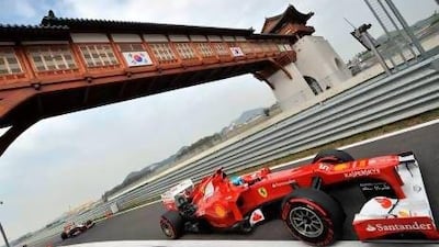 Ferrari driver Fernando Alonso enters the pit lane.