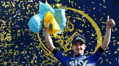 Italian rider Elia Viviani of Team Sky wears the overall leader's blue jersey as he celebrates on the podium after winning the second stage of the 2016 Dubai Tour on Thursday. Daniel Dal Zennaro / EPA / February 4, 2016