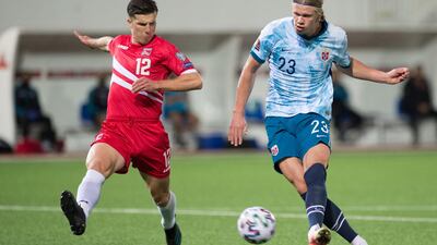 Norway's Erling Braut Haaland under pressure from Jayce Olivero of Gibraltor. AFP