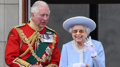 King Charles, then the heir to the throne, and his mother Queen Elizabeth watch a special fly-past from the Buckingham Palace balcony during the celebrations for her platinum jubilee earlier this year. AFP