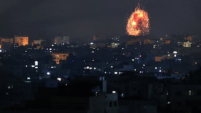 An explosion lights up the sky during an Israeli air strike on Beit Lahia in northern Gaza on Friday. AFP / Mohammed Abed