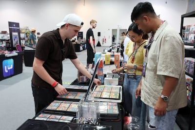 Trading cards were a major part of Playgrounds, with collectors browsing binders and discussing cards directly with vendors. Chris Whiteoak / The National