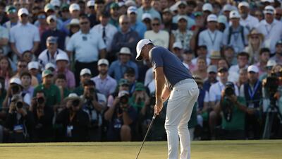 Rory McIlroy putts in a play-off against Justin Rose to win the 2025 Masters. EPA