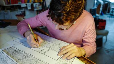 Mawil, author of Kinderland, works in his studio in Berlin. John Macdougall / AFP